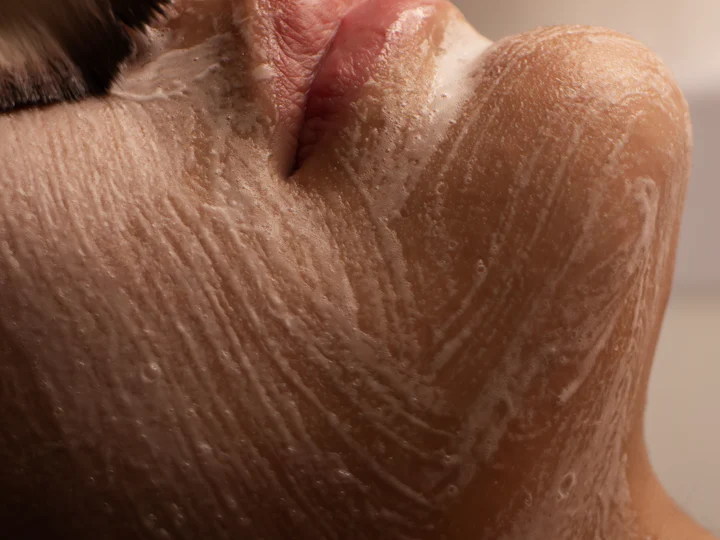 Close-up of a cream mask brushed over the chin and lips